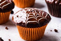 Chocolate Fudge Spiderweb Muffins Recipe — Decadent Halloween Treat