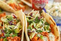 Baked Buffalo Chicken Tacos with Cilantro-Lime Crema