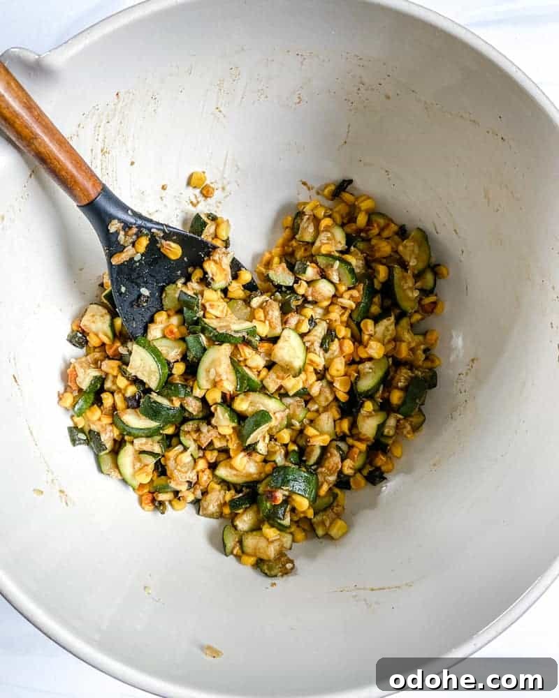 various ingredients in a white bowl against a white background