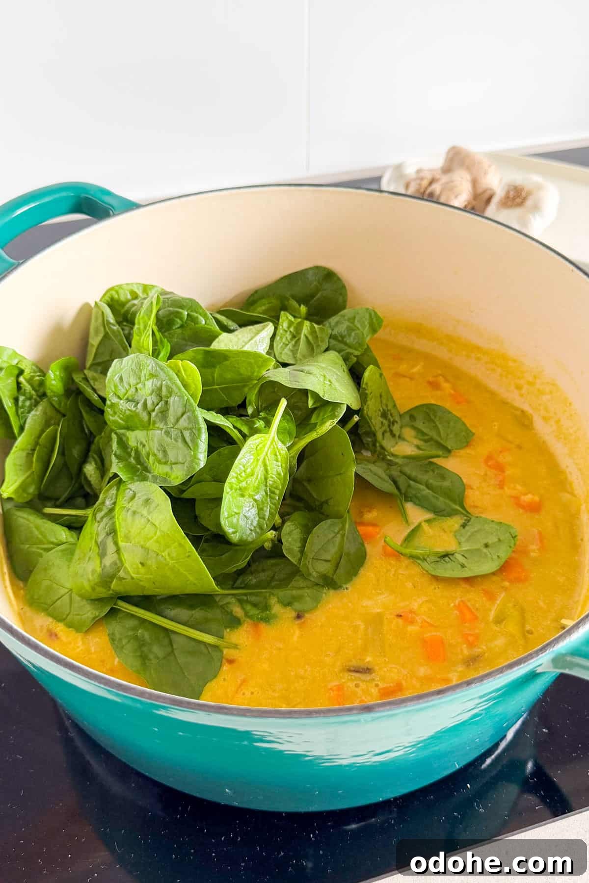 Baby spinach added to the soup.