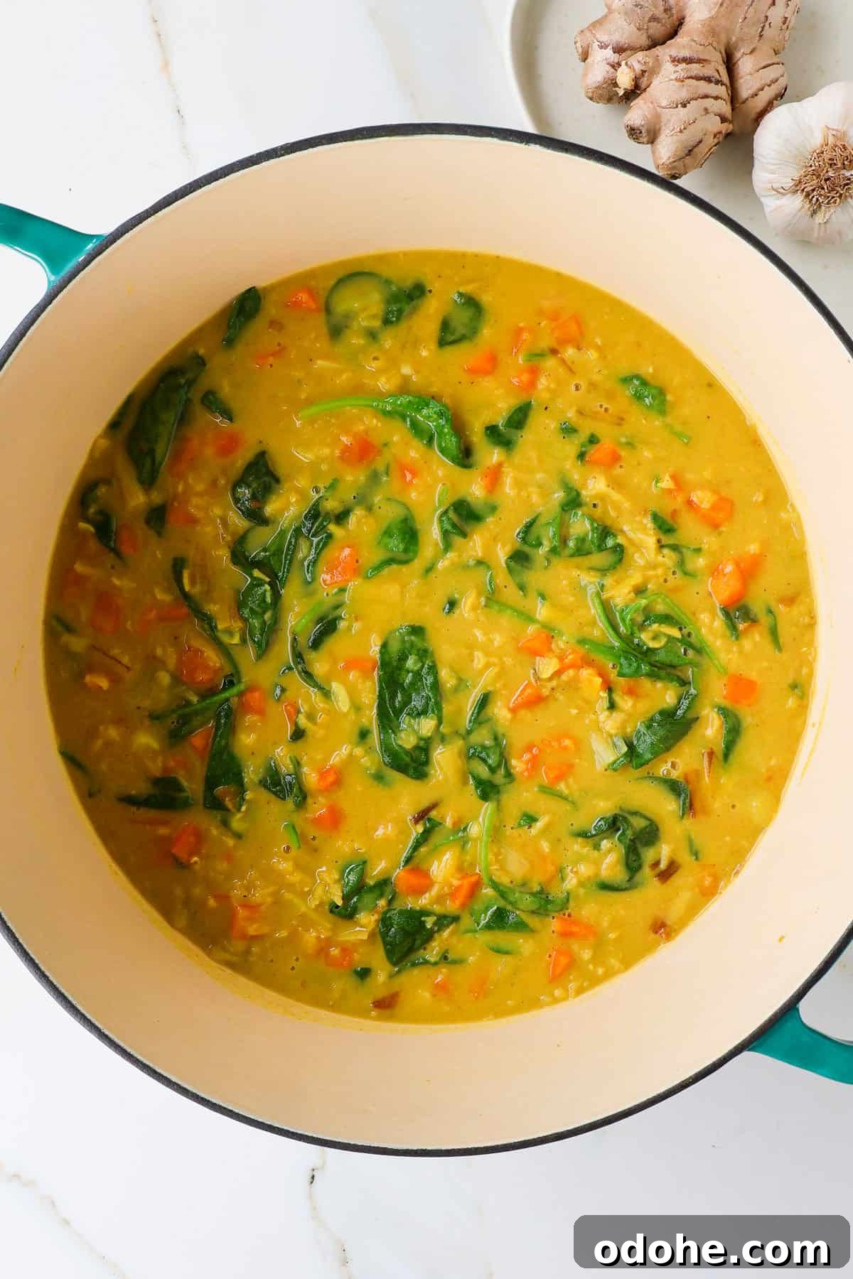 Carrot and lentil soup in a large pot.