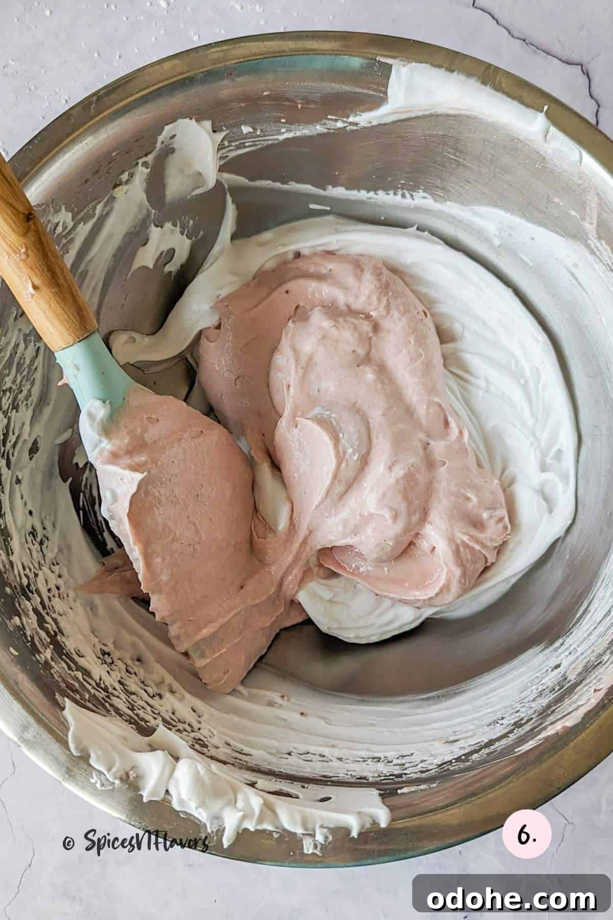 Strawberry Cream Cheese Cake Filling Recipe for Moist Layer Cakes 7 folding the strawberry cream cheese mixture into the whipped cream