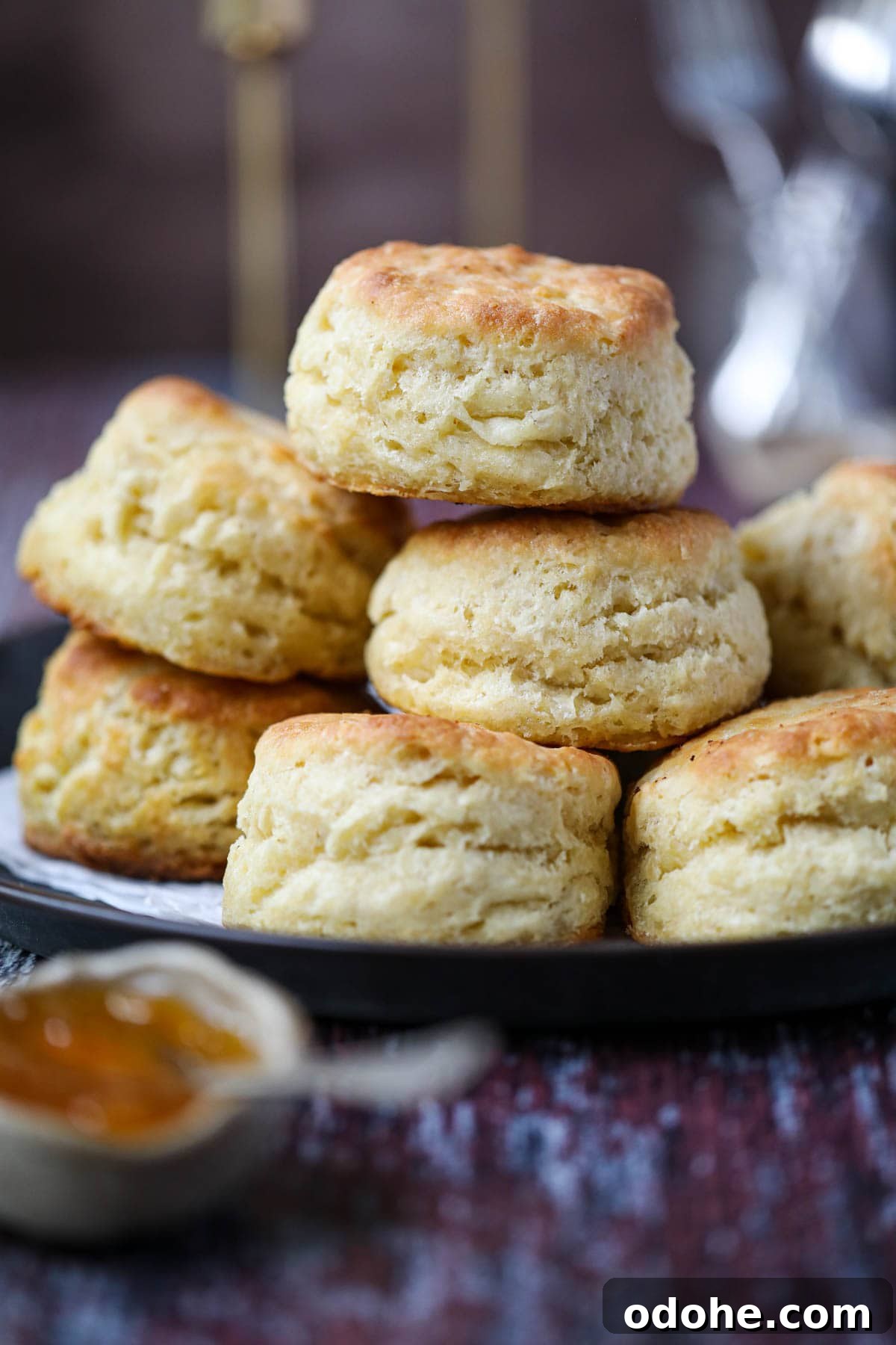 southern buttermilk biscuits stacked on a tray.