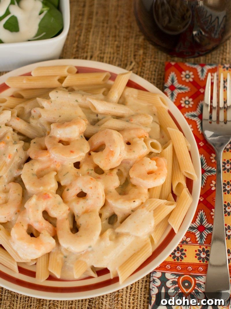 Believe it or not, this delicious Shrimp Scampi Alfredo is ready in about 15 minutes and is lightened up too!