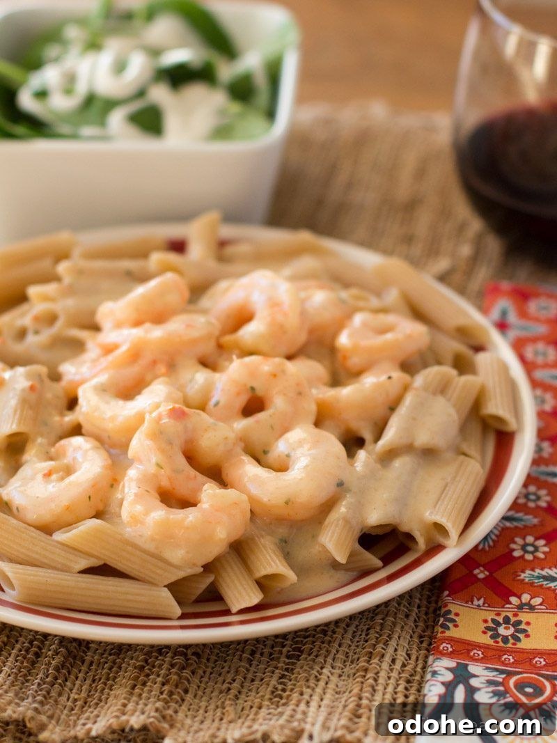 Believe it or not, this delicious Shrimp Scampi Alfredo is ready in about 15 minutes and is lightened up too!