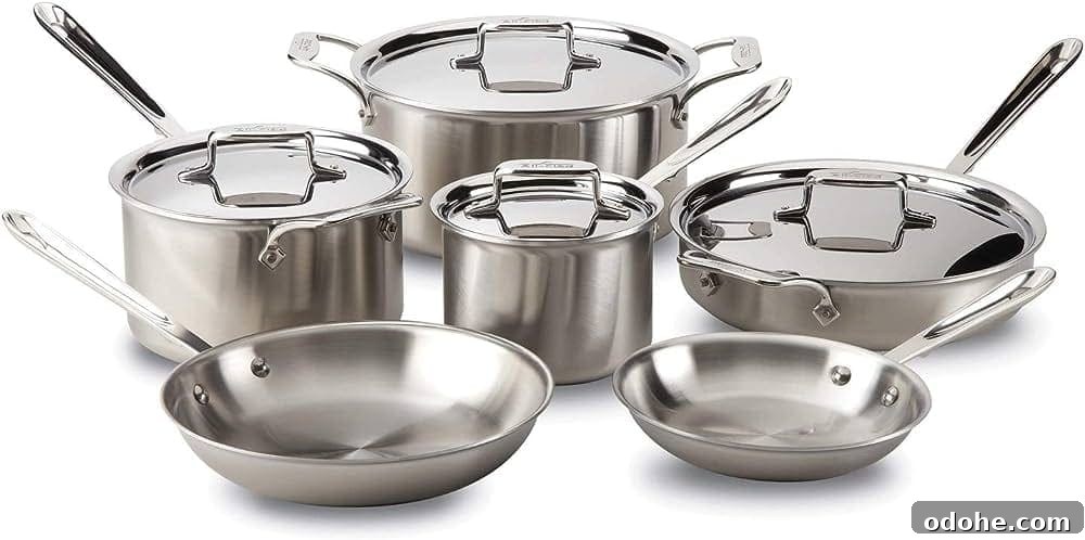 A set of All-Clad stainless steel pots and pans.