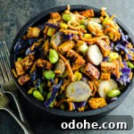 Spiralized sweet potato noodles, purple cabbage, edamame, corn, water chestnuts and tofu in a creamy peanut sauce.