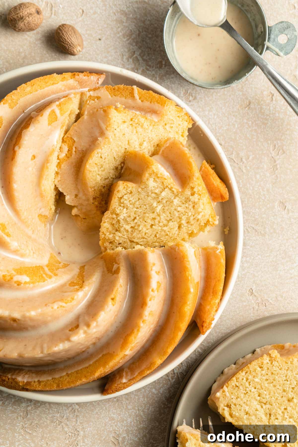 Decadent Eggnog Bundt Cake Recipe for Holiday Gatherings 7 Overhead view of eggnog cake on a plate and cut into slices.