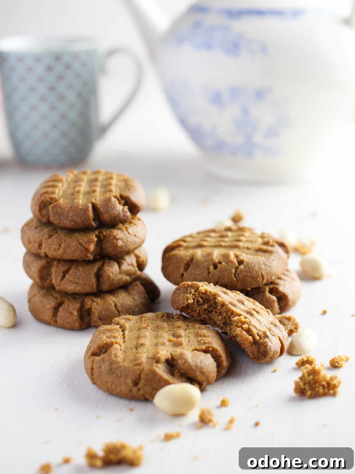 Photo showing a pile of 15-minute vegan and gluten-free peanut butter cookies and a teapot