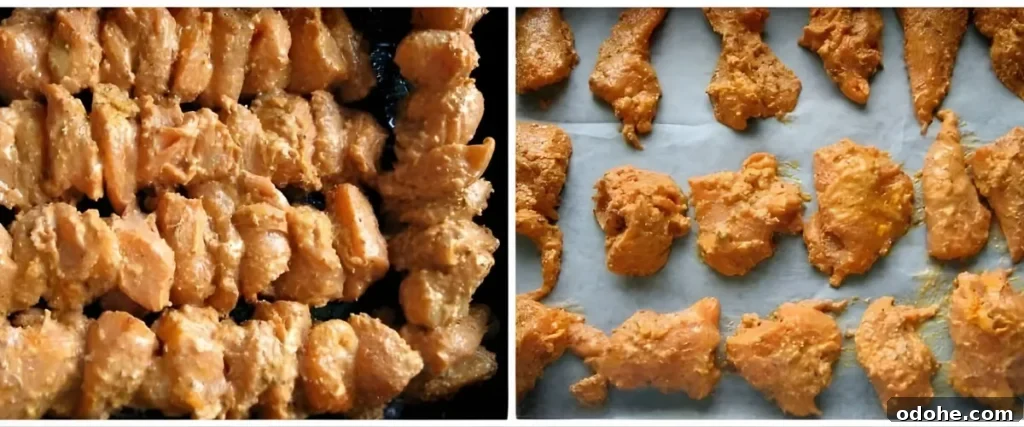 Chicken Tikka Recipe: Authentic Murgh Tikka Marinade & Grill Tips 5 Marinated chicken arranged on skewers and baking tray before cooking.