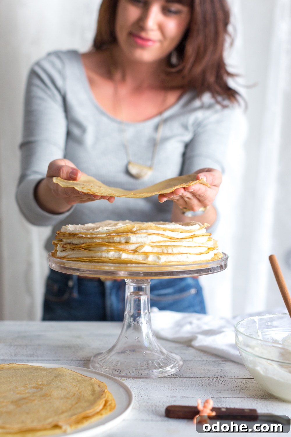 Crepe King Cake: Traditional French King Cake Made with Crepes 14 Crepe King Cake adding crepe layers
