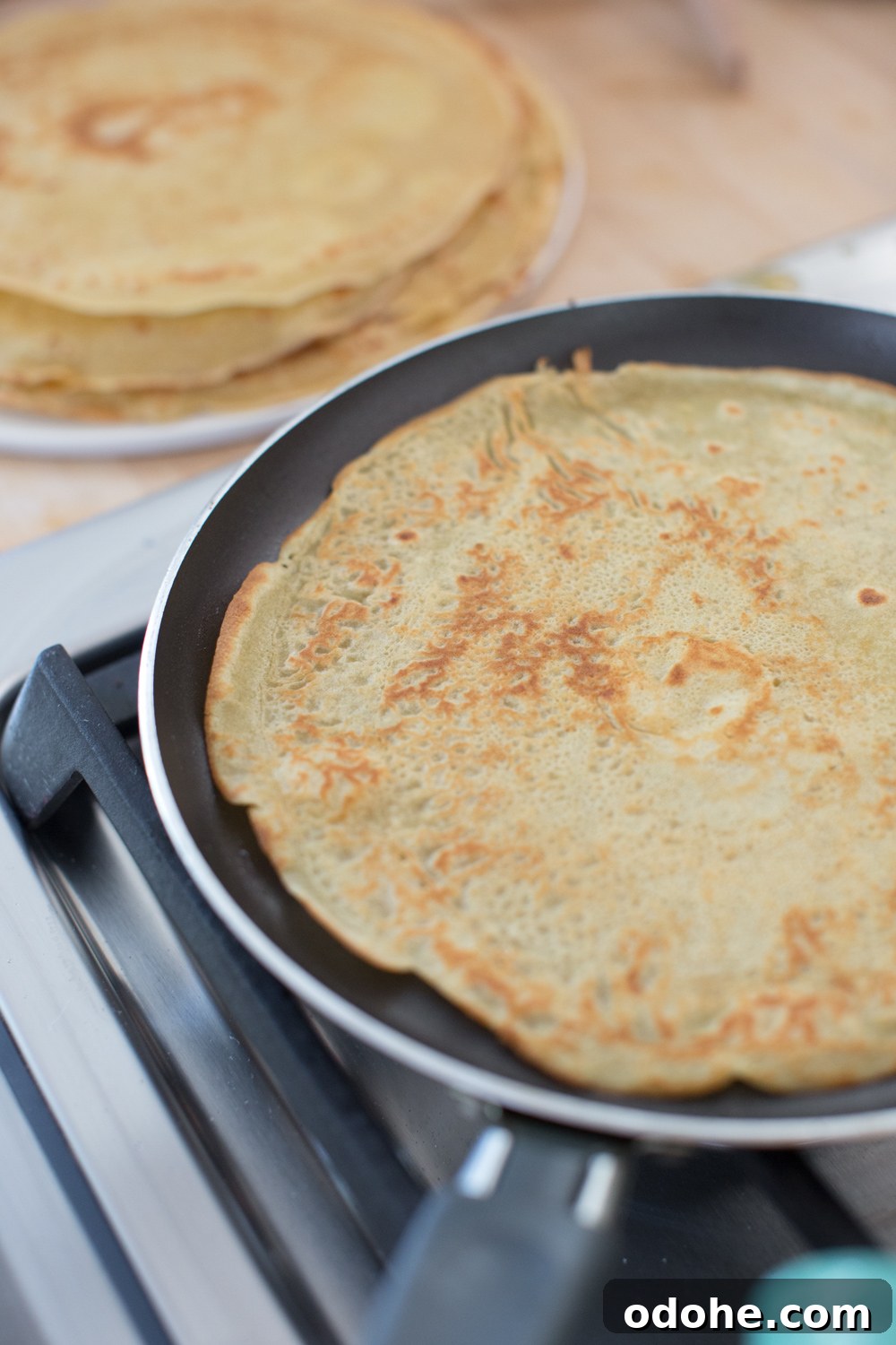Crepe King Cake: Traditional French King Cake Made with Crepes 9 Crepe King Cake - making crepes