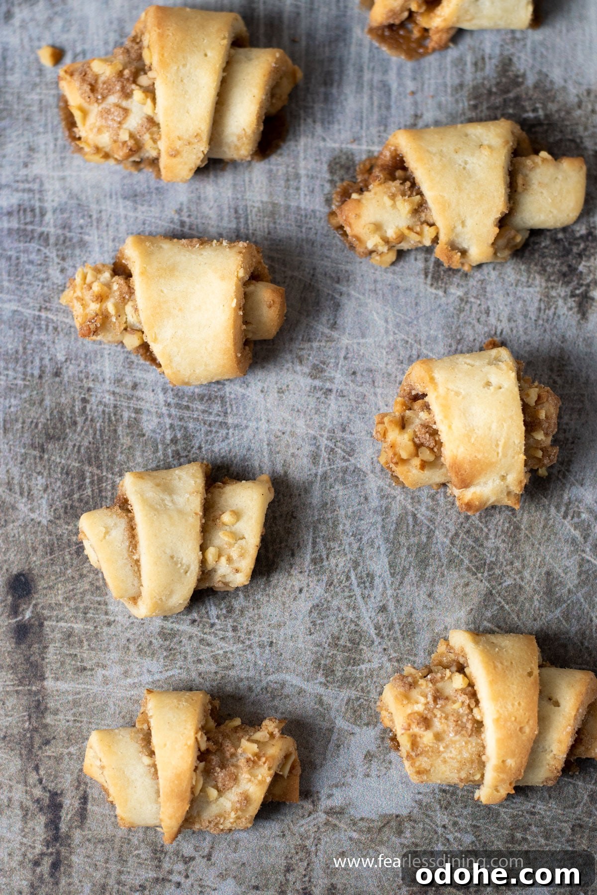 Homemade Gluten-Free Rugelach Recipe: Flaky, Dairy-Free Pastries 10 Baked gluten-free rugelach on a cookie sheet.