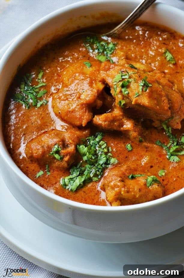 Almond Boneless chicken gravy in white bowl