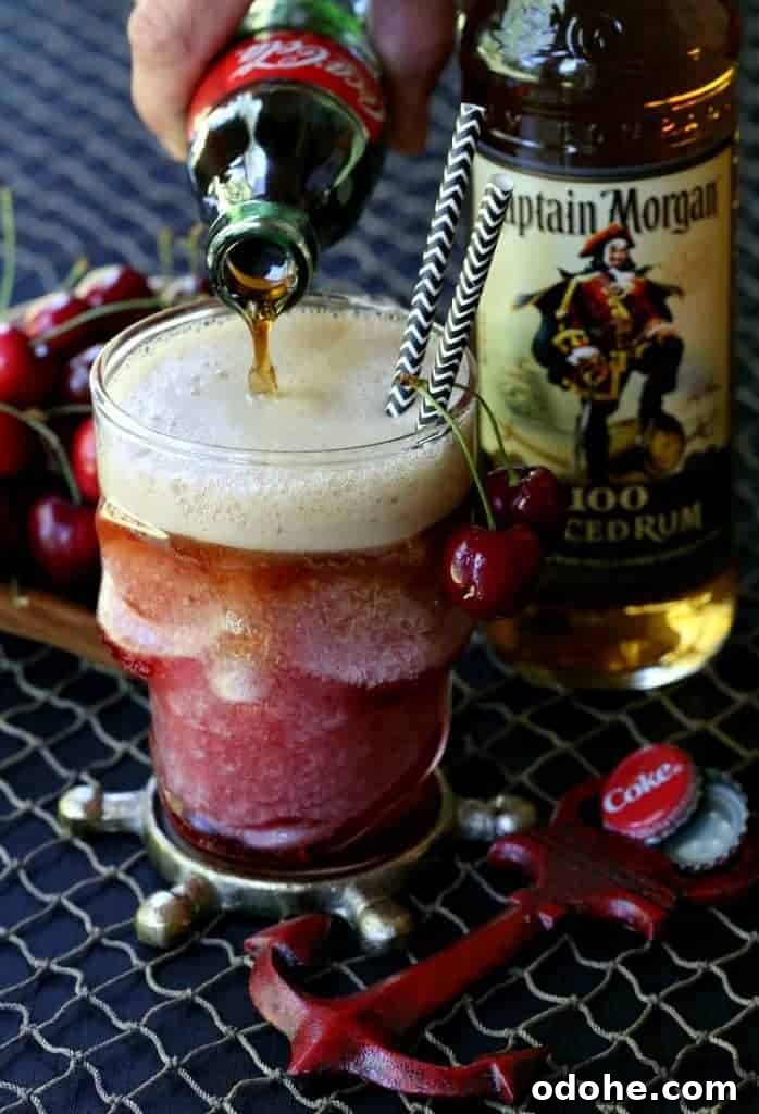 Frozen Rum and Cherry Coke pouring cola