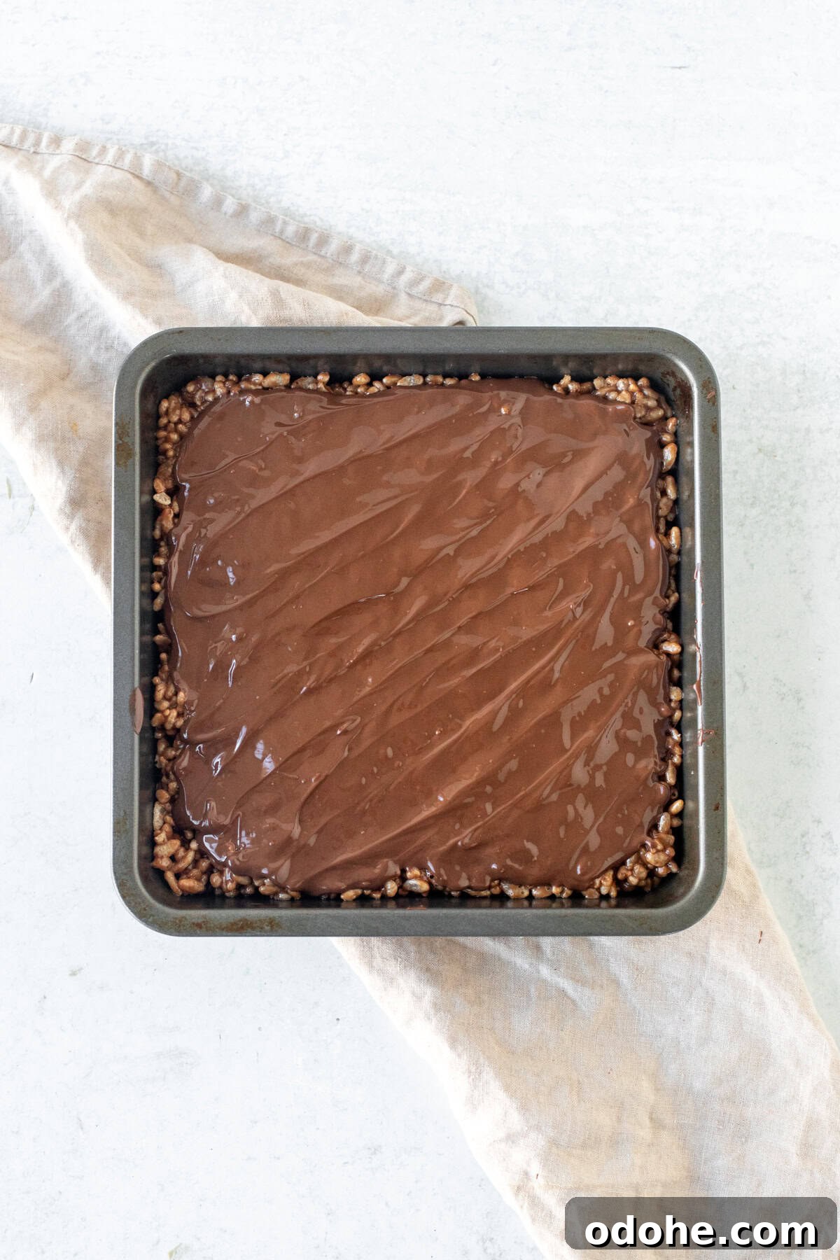 Pan of Mars Bar Rice Krispie treats with chocolate topping