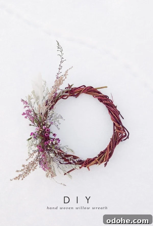 A natural handmade willow wreaths in the snow with dried flowers. - art supplies