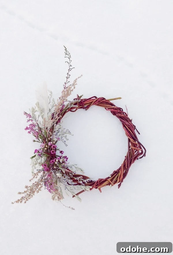 Willow wreath with flowers in the snow. - privacy preferences
