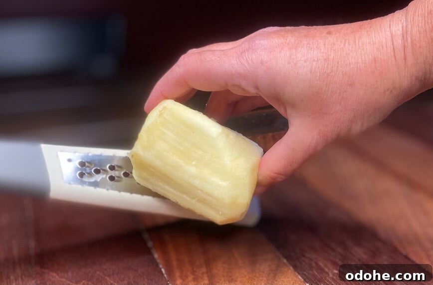 Grating an apple.