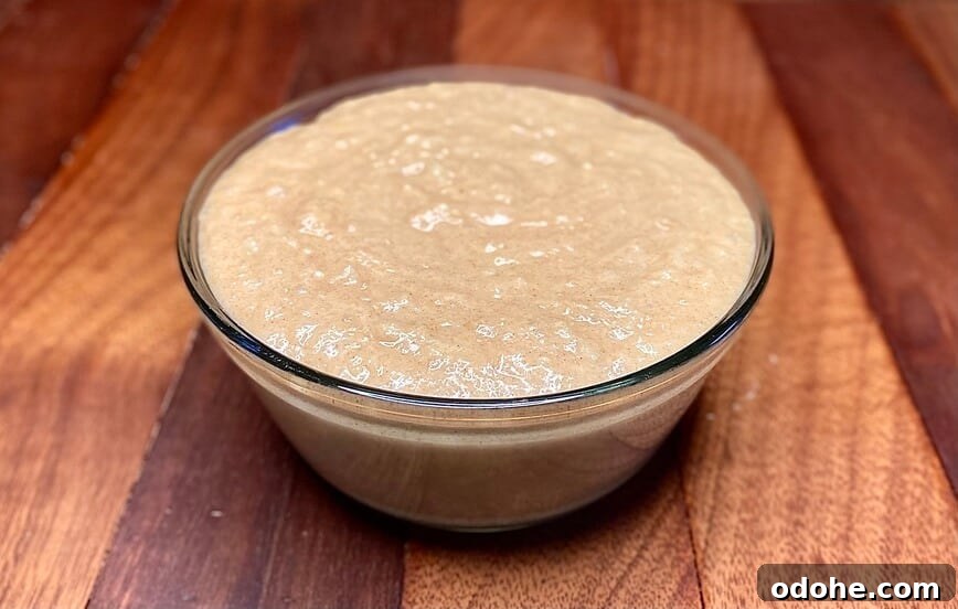 Muffin batter in a round glass bowl.