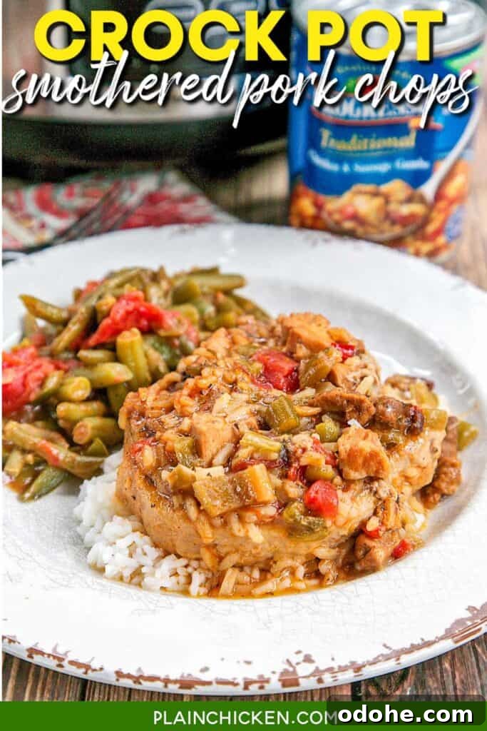 Slow-Cooker Smothered Pork Chops with Onion Gravy 2 smothered pork chops on a plate with green beans with text overlay