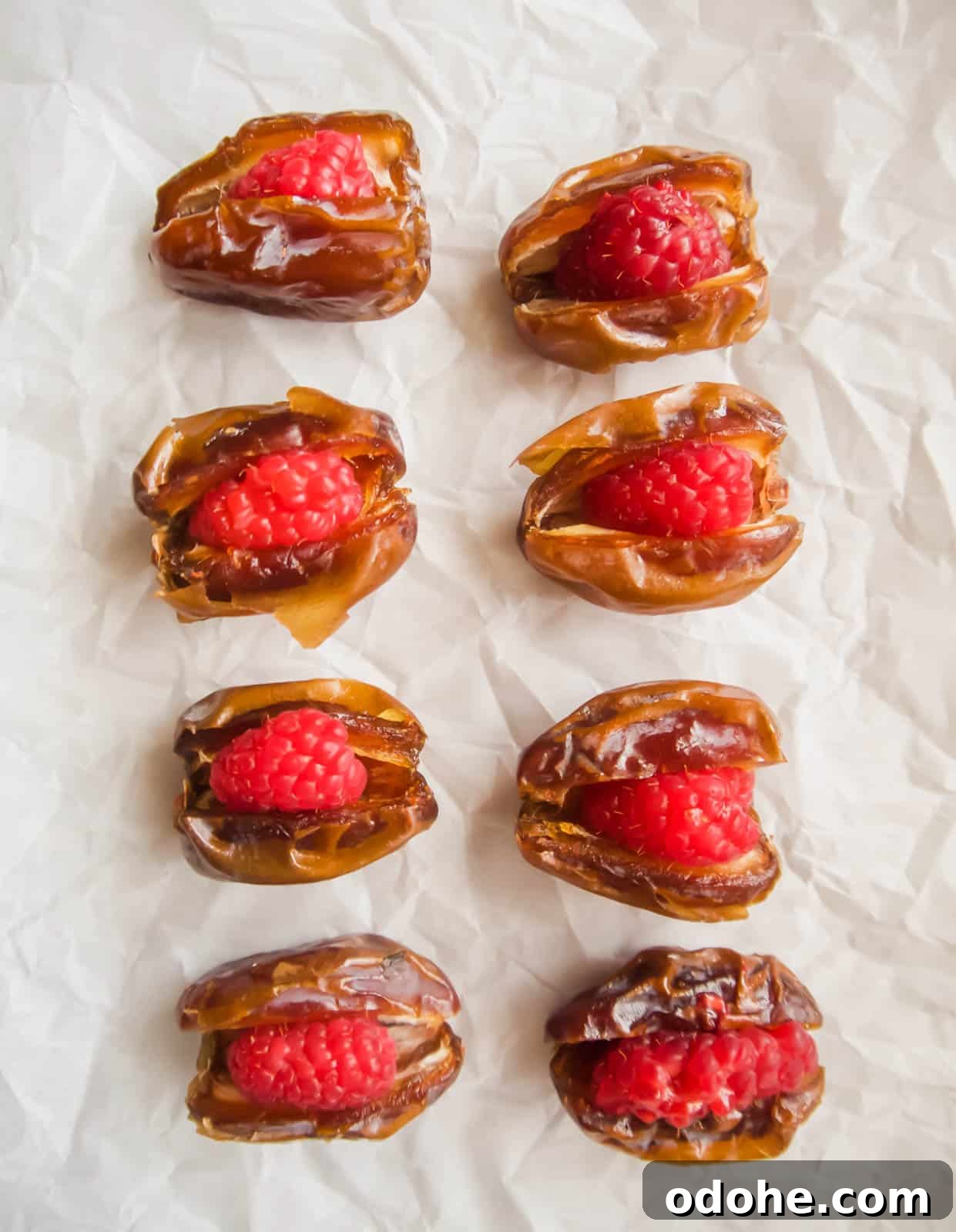 Bacon-Wrapped Raspberry-Stuffed Dates | Paleo & Whole30-Friendly 6 Dates stuffed with raspberries.