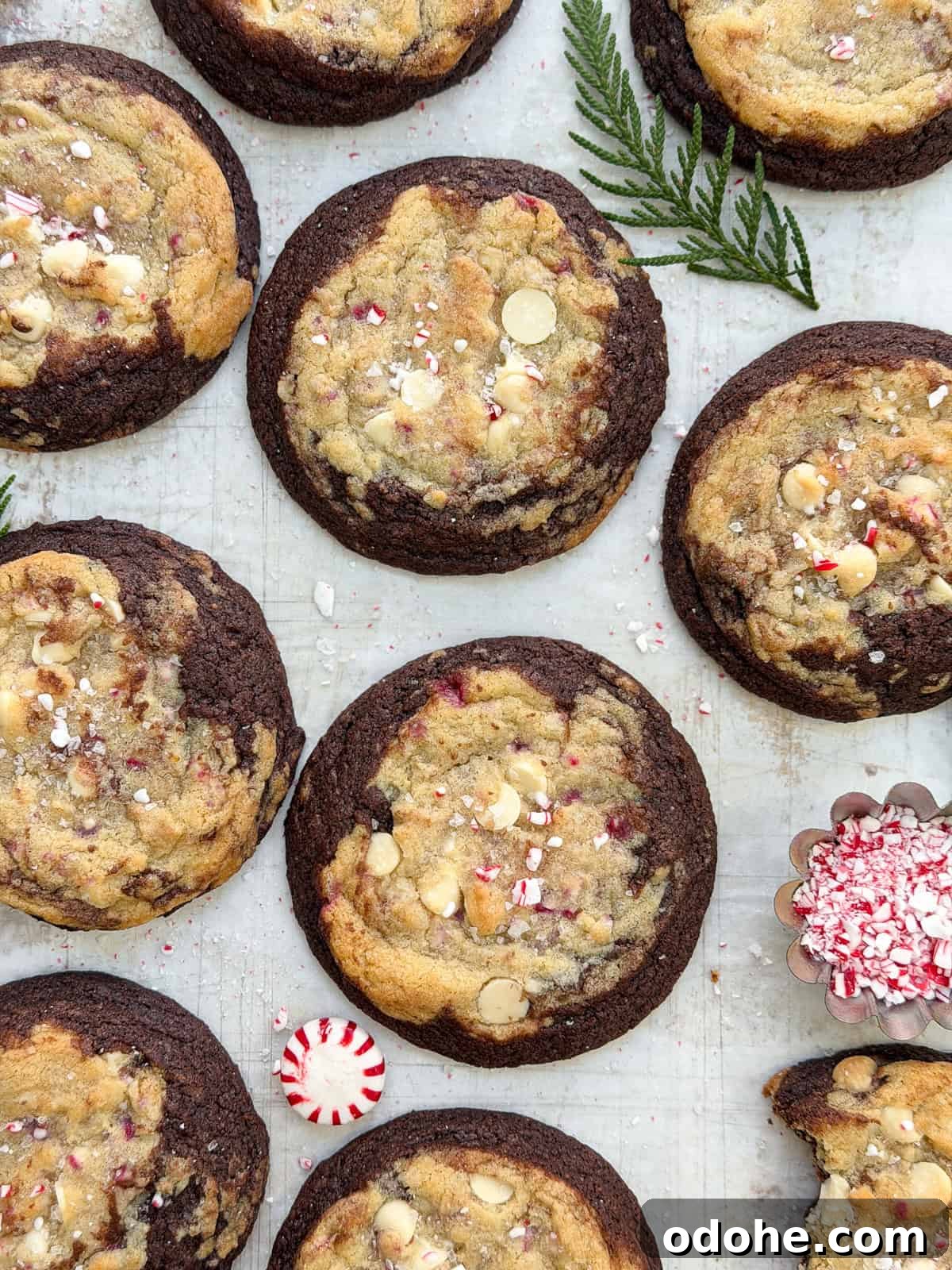 Peppermint White Chocolate Brookie Cookies Recipe 2 Peppermint white chocolate brookies cookies all together with peppermint candies on the side.