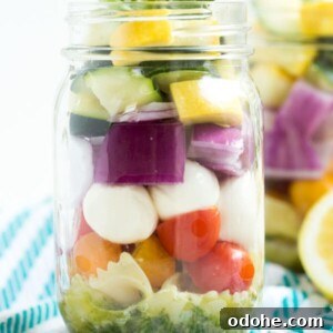 Lemon Basil Vegetable Pasta Salad in a Jar – five layers of flavors combine with a fresh lemon basil dressing to create this easy pasta salad!