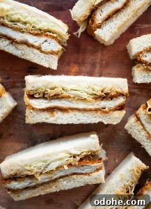 overhead shot of katsu sandwiches spread out across wooden backdrop