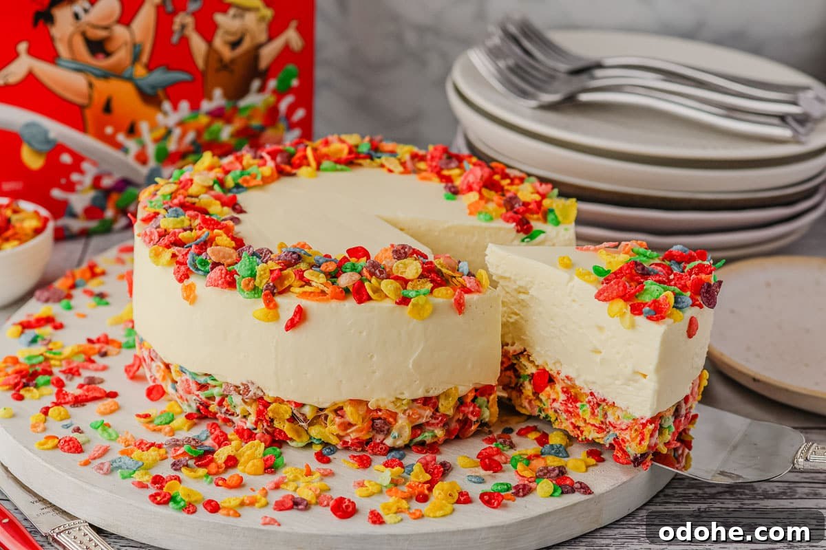 No-Bake Cheesecake Recipes: Simple, No-Oven Dessert Ideas 13 Serving a slice of Fruity Pebbles cheesecake.