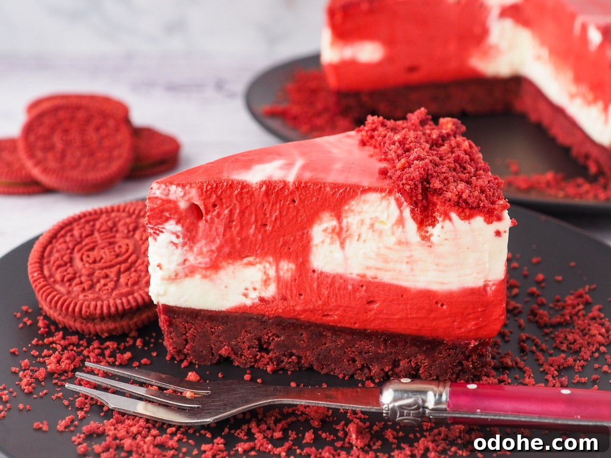 No-Bake Cheesecake Recipes: Simple, No-Oven Dessert Ideas 15 Slice of cheesecake on a plate with a fork and crumbs, with red velvet Oreos and rest of cake in the background.