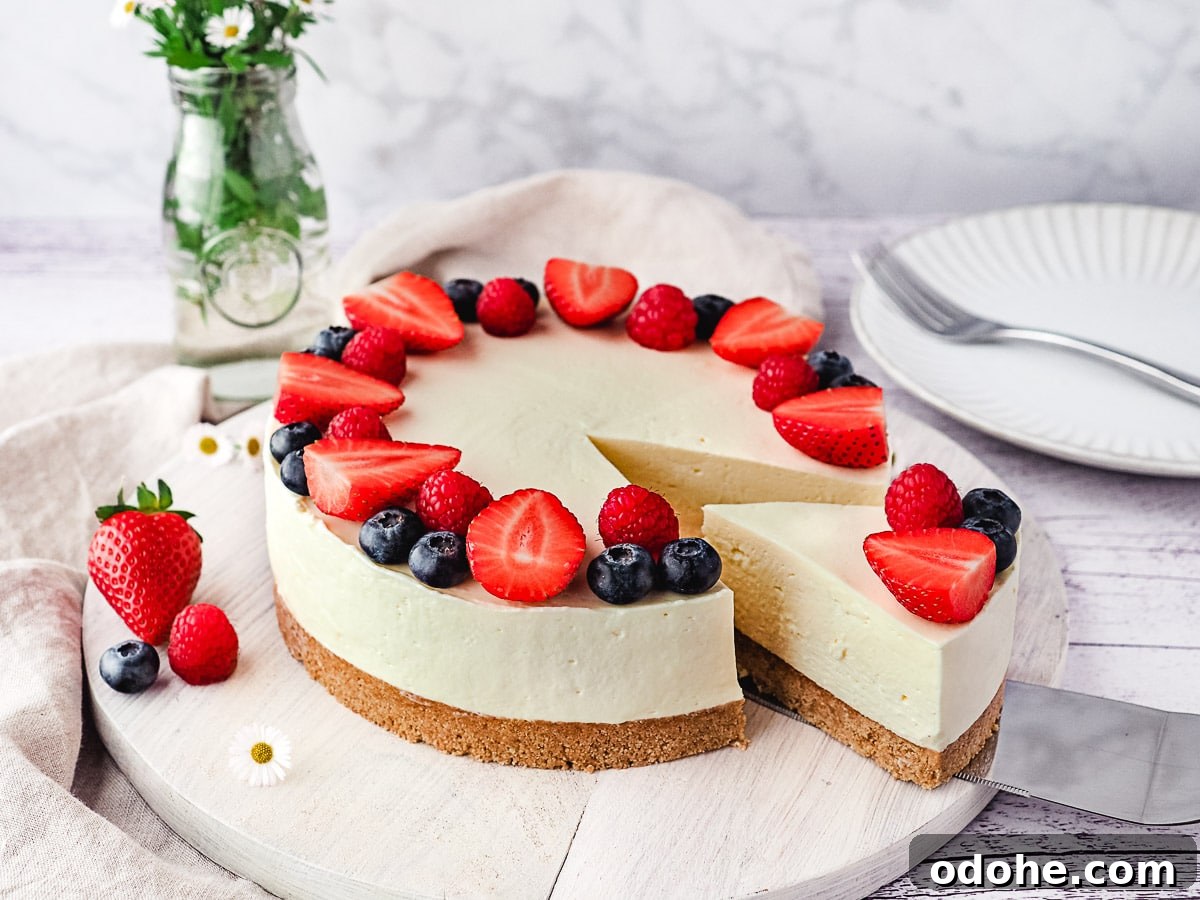 No-Bake Cheesecake Recipes: Simple, No-Oven Dessert Ideas 3 Slicing cheesecake decorated with fresh berries.