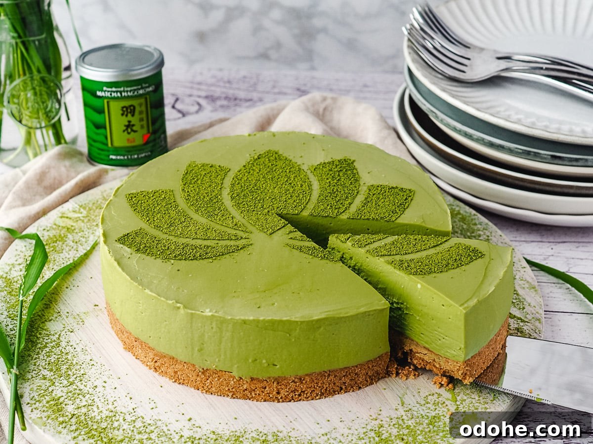 No-Bake Cheesecake Recipes: Simple, No-Oven Dessert Ideas 33 Slicing cheesecake, with jar of green tea and stack of plates in background.