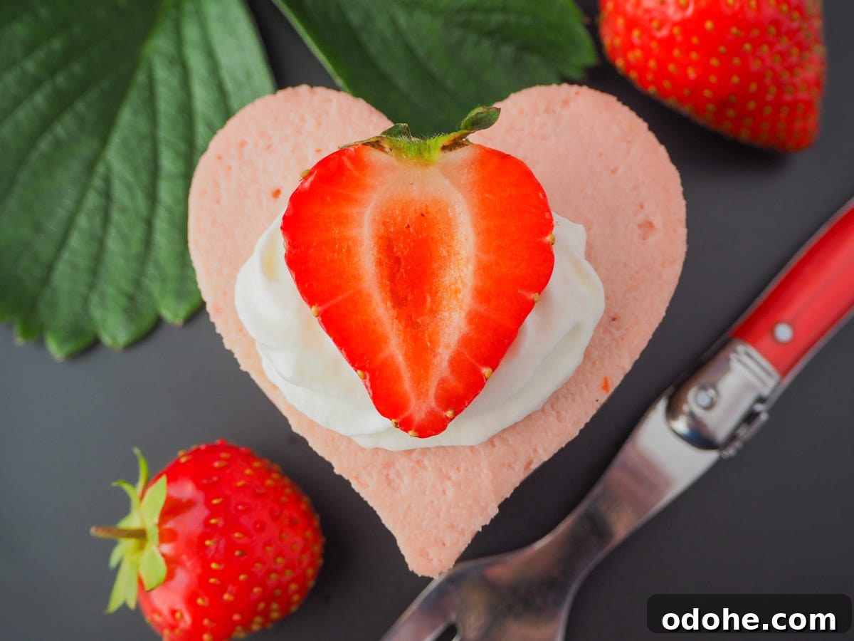 No-Bake Cheesecake Recipes: Simple, No-Oven Dessert Ideas 37 Heart shaped mini strawberry cheesecake with whipped cream, fresh strawberries, fresh strawberry leaves and a vintage fork.