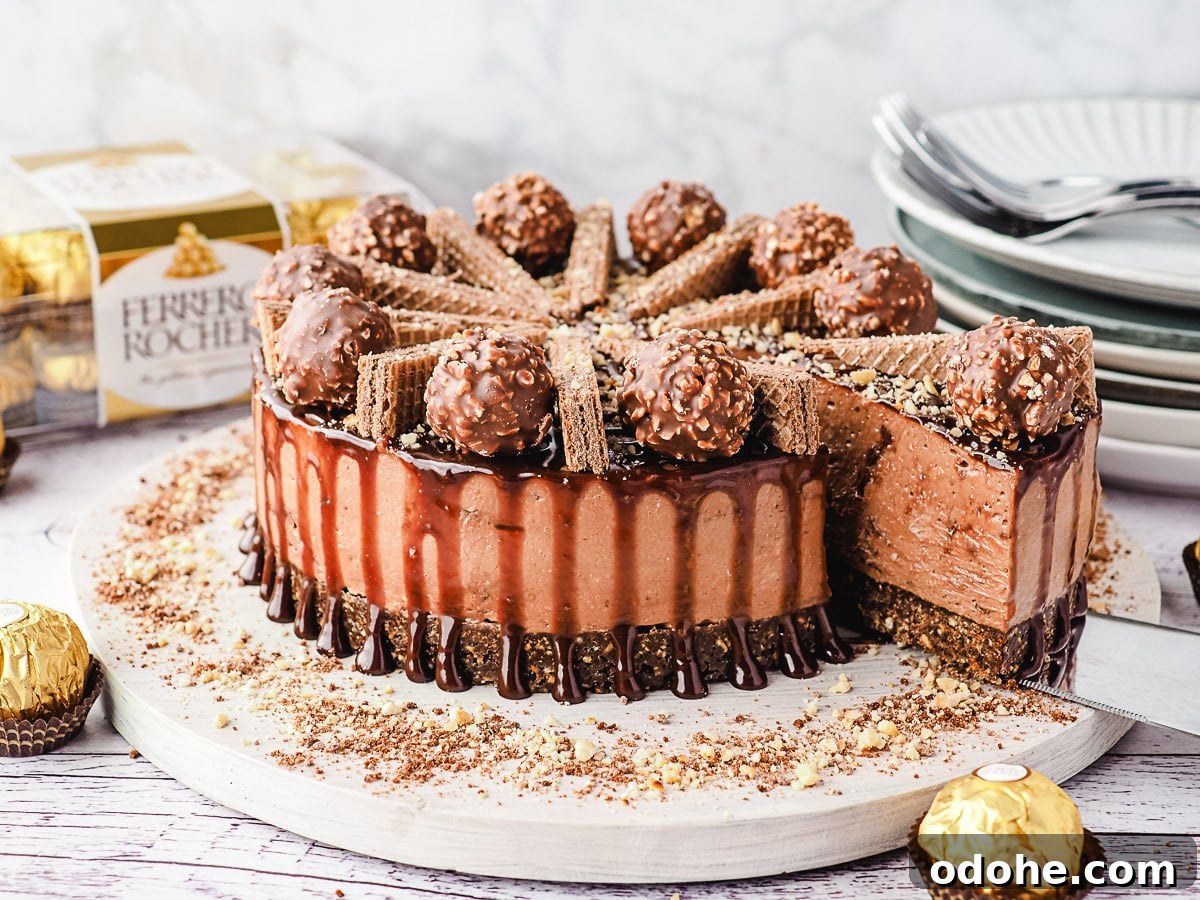 No-Bake Cheesecake Recipes: Simple, No-Oven Dessert Ideas 7 Slicing cheesecake, with Ferrero Rocher and stack of plates and forks in background.