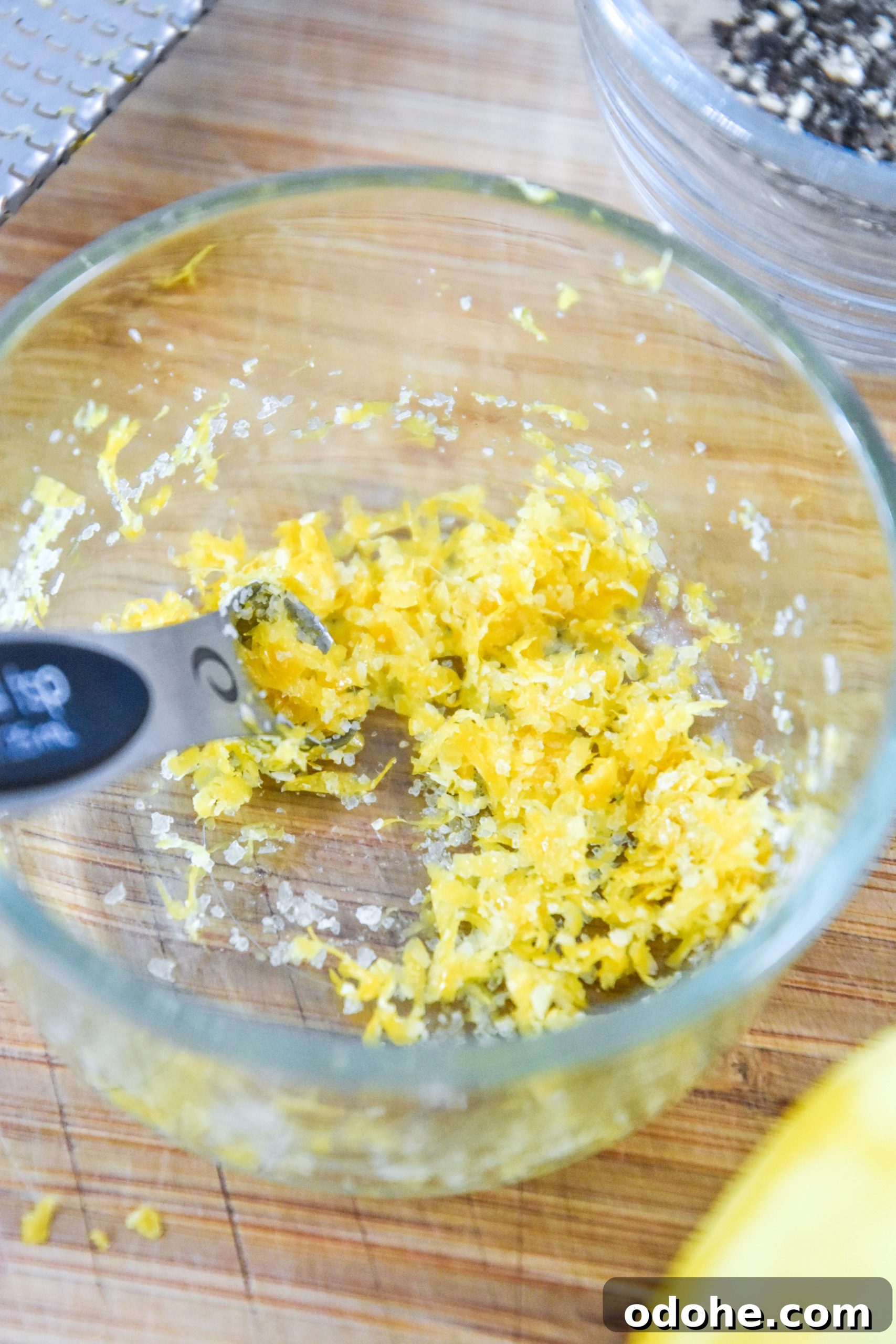 lemon zest and salt in a bowl for the lemon pepper salmon recipe.