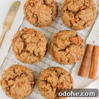 Carrot cake muffins on a wire cooling rack.