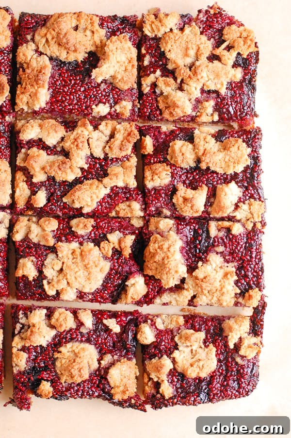 berry crumble bars on parchment paper