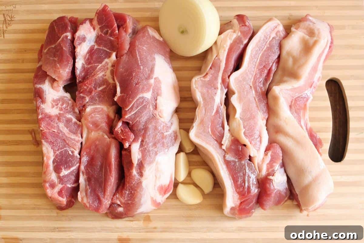 Vietnamese Braised Pork and Eggs (Thịt Kho Trứng) 3 Some ingredients for Vietnamese Braised Pork with Eggs ( Thịt kho trứng) on a cutting board.