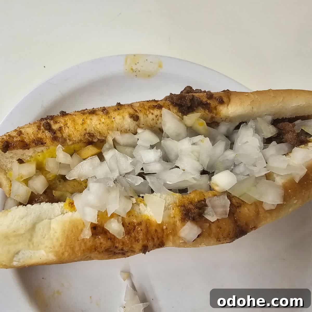 Coney hot dog on a white plate
