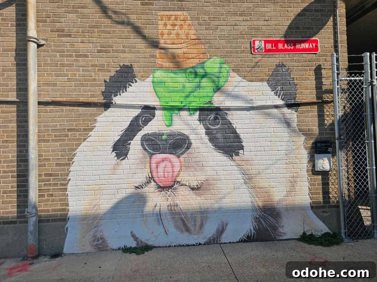 Panda mural with ice cream cone on the panda head dripping green ice cream and the pandas tonque out