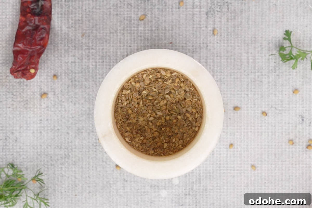 Powdered cumin and coriander seeds.