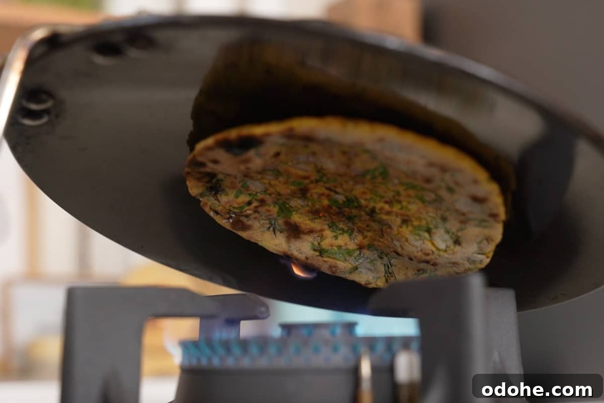 Cooking roti over direct flame.