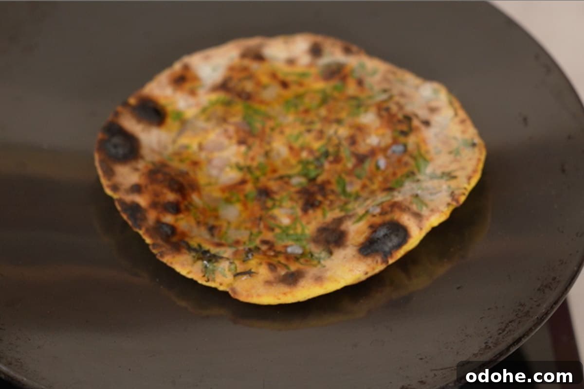 Ready missi roti slathered with ghee.