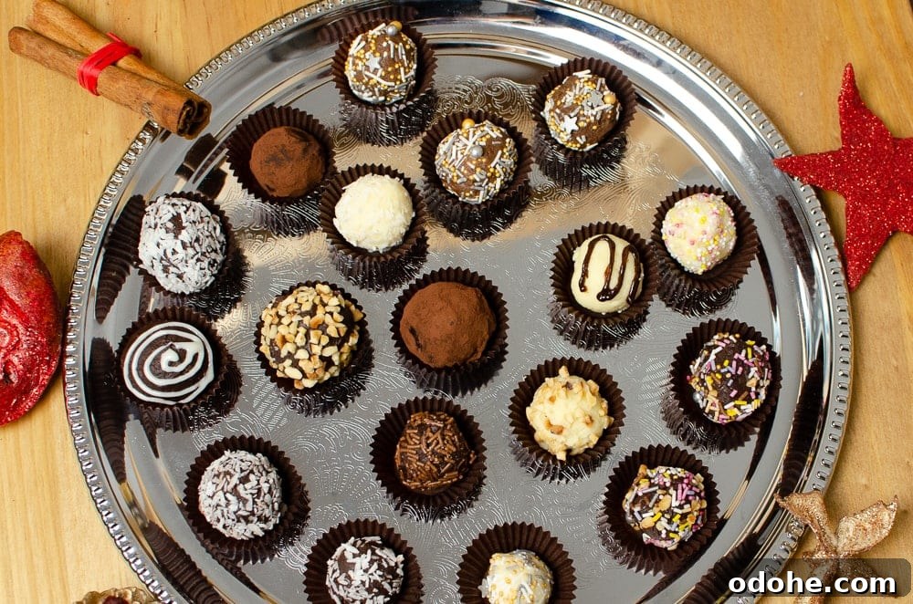 Decadent White Chocolate Truffles Recipe for Homemade Gifts 14 Mixture of our chocolate truffles served on a silver serving tray with Christmas decorations around the tray. Our white chocolate truffles have colourful sprinkles,coconut and nuts on them.