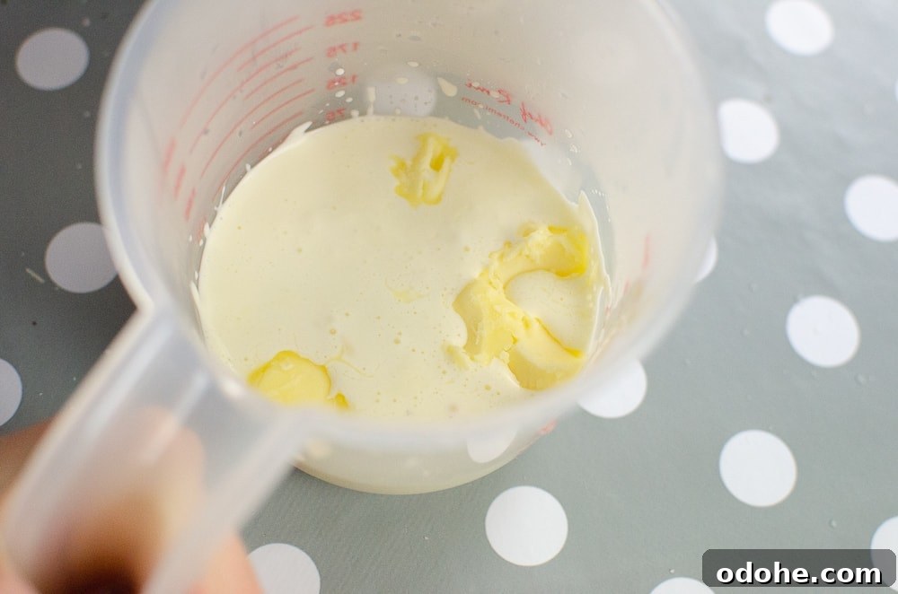 Decadent White Chocolate Truffles Recipe for Homemade Gifts 5 Hot cream and butter in a plastic jug to mix together to place in with the white chocolate