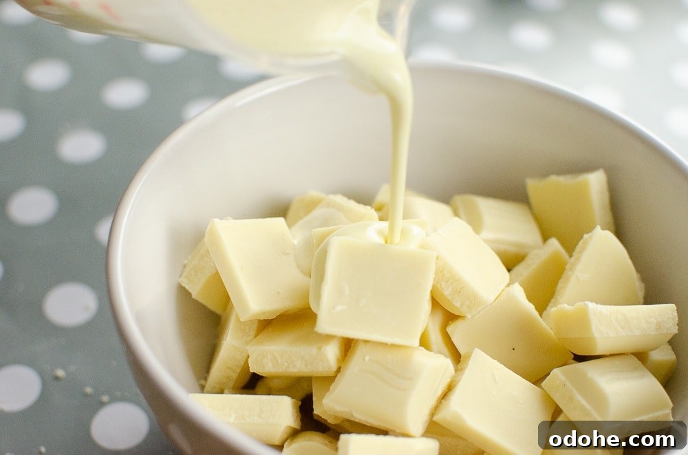 Decadent White Chocolate Truffles Recipe for Homemade Gifts 6 Cream and butter mix being poured onto white chocolate chunks to make our white chocolate chunks