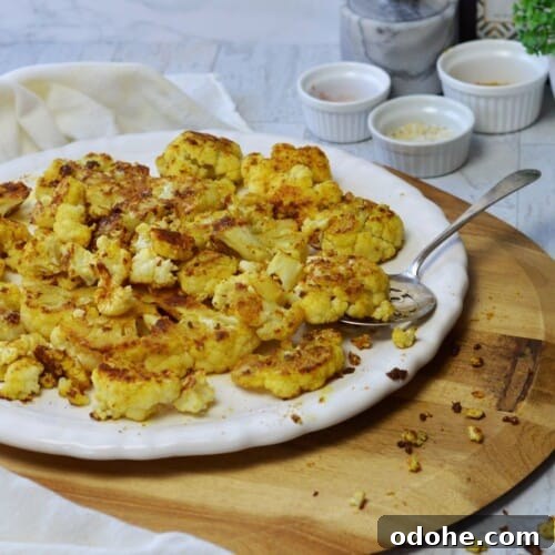 white platter roasted curry cauliflower steaks