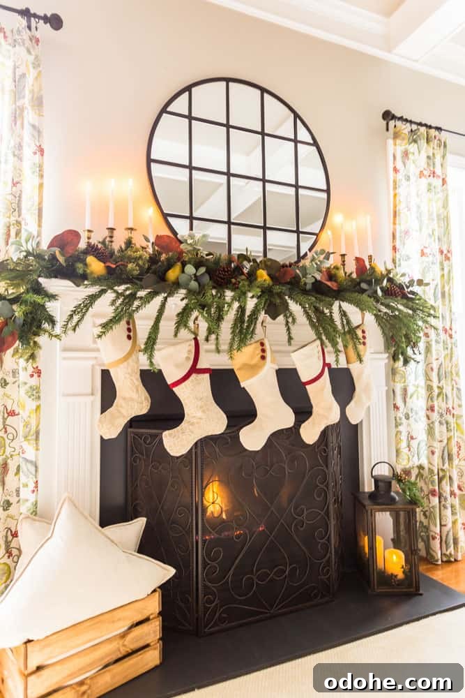 13 Timeless Neutral Christmas Decorating Ideas for Your Home 16 Fireplace with painted marble surround decorated for Christmas with South House Designs stockings and greenery