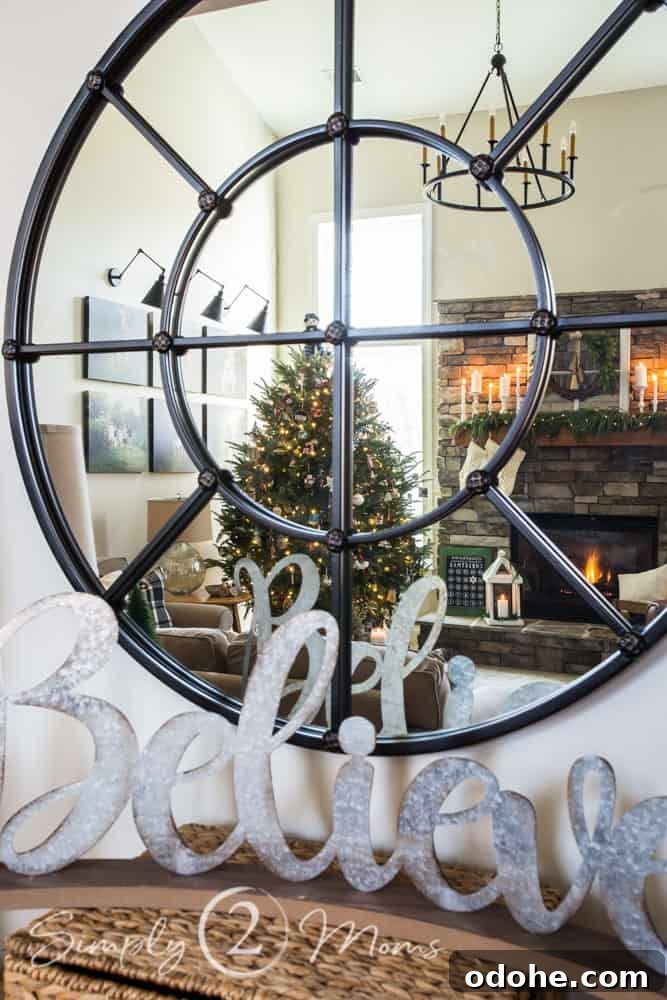 13 Timeless Neutral Christmas Decorating Ideas for Your Home 17 view of family room decorated for christmas home tour in reflection of mirror